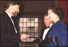 Tracy is given the Wirth Medal by The Queen of England